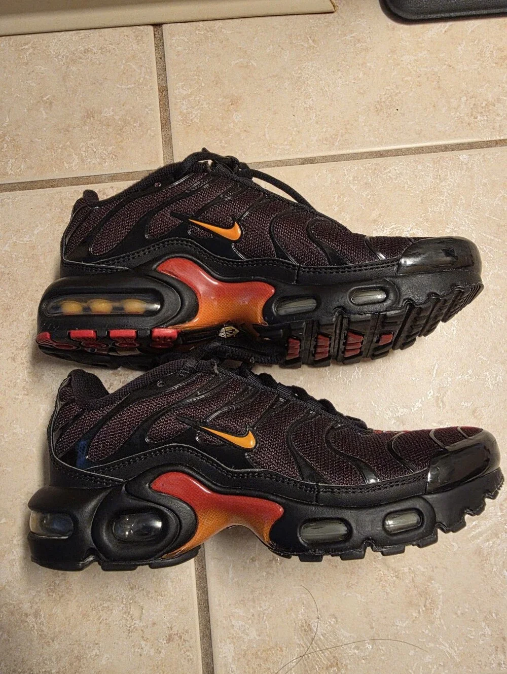 Nike Air Max Plus Black with Red and Yellow Accents